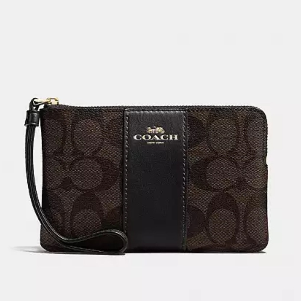 Coach CORNER ZIP WRISTLET IN SIGNATURE CANVAS
new in packaging
